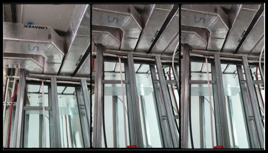 Conductos de ventilación y estructura metálica en un falso techo.