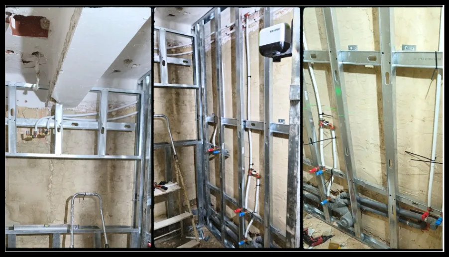 Tuberías de agua y calentador instalados en un entramado metálico.
